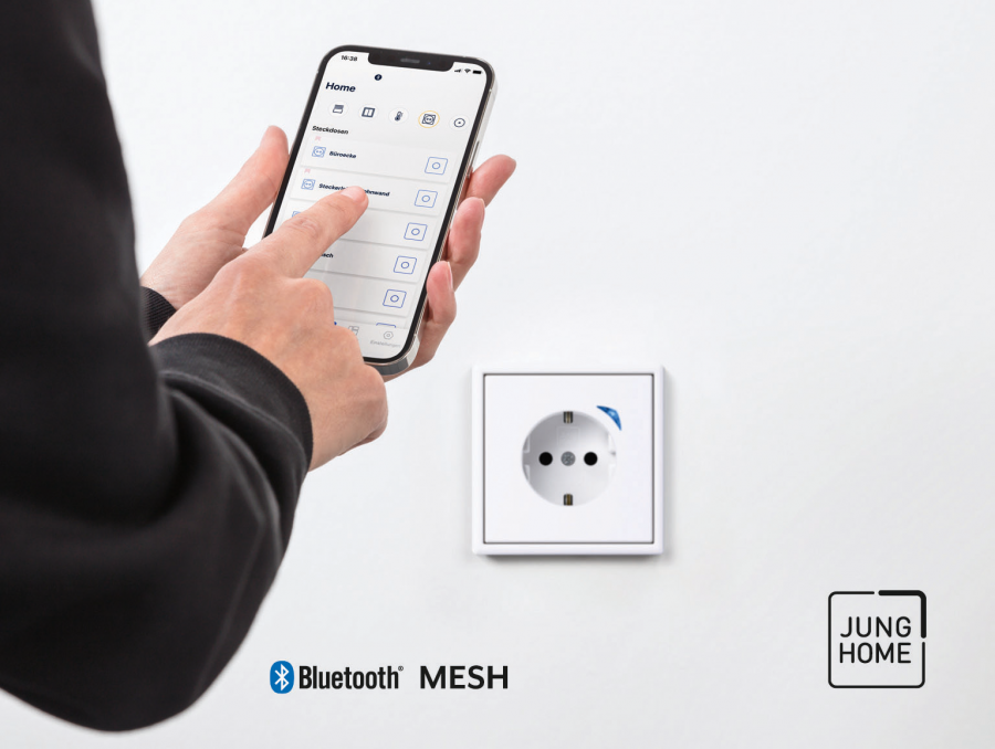 JUNG AMBI JUNG HOME installer sets up SCHUKO socket smartphone RGB